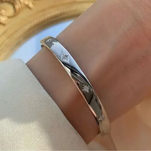 Silver open cuff star bracelet